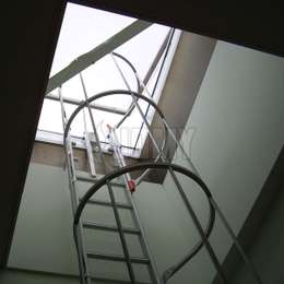 Ladder for flat roof exit window Flat roof exit window and shaft with a cage ladder used to access the flat roof.